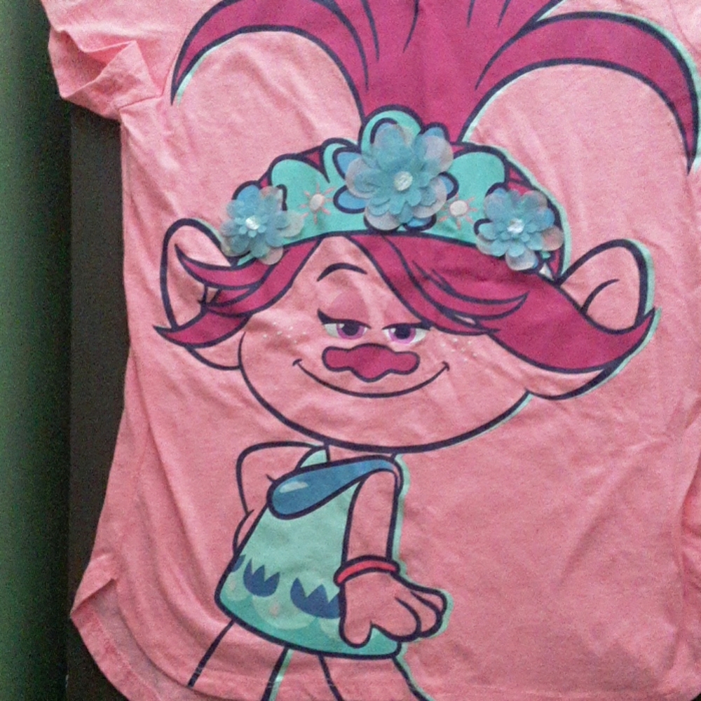 A shirt with poppy on the front